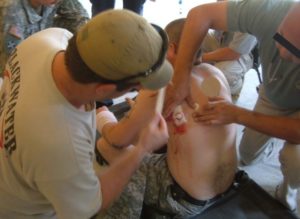 Brian Duff treating wounded in Iraq.