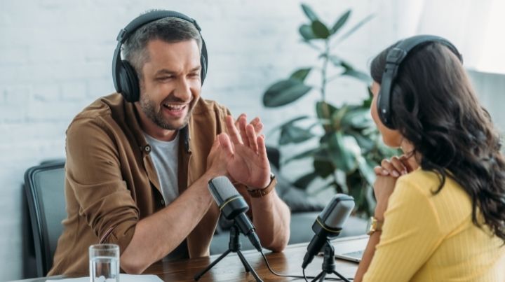 A young couple listening to a podcast