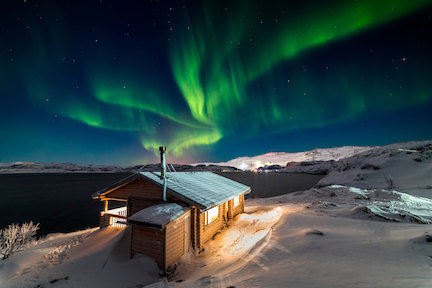 northern lights above a cabin