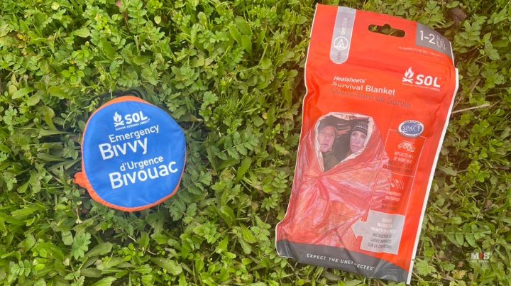 S.O.L. Products Space Blankets on green grass