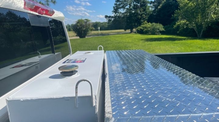 L Shaped Fuel Transfer Tank Cross Bed Overlooking a Field