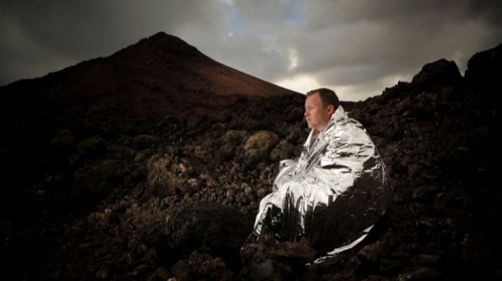 Man wrapped in emergency blanket