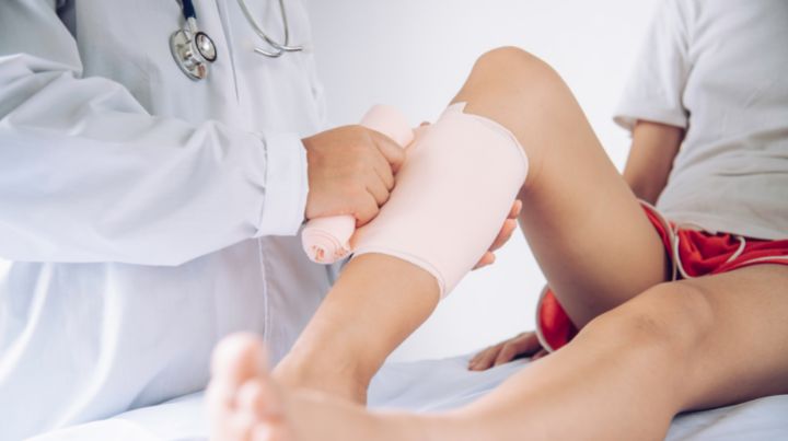 Doctor treating chronic wound