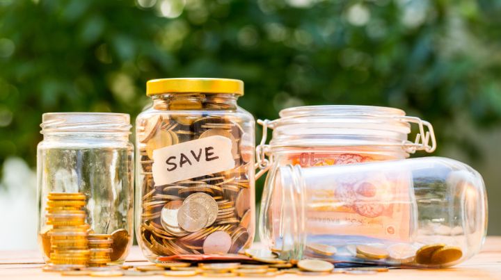 A jar of coins in a garden