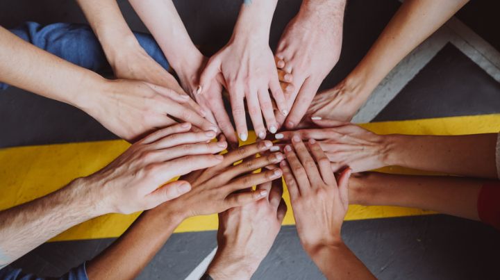 A group of friends holding hands