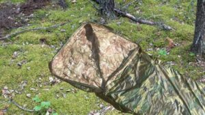 Poncho Liner on forest floor