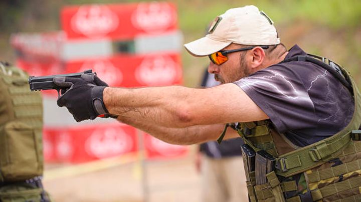 Person on shooting range training with a pistol