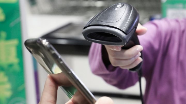 A scanner scanning a mobile phone with WeChat