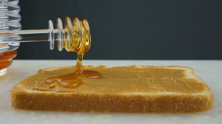 photo of honey being drizzled onto peanut butter