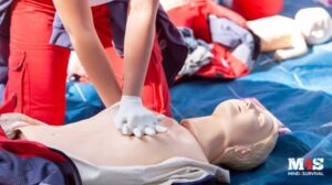 A person practicing CPR.