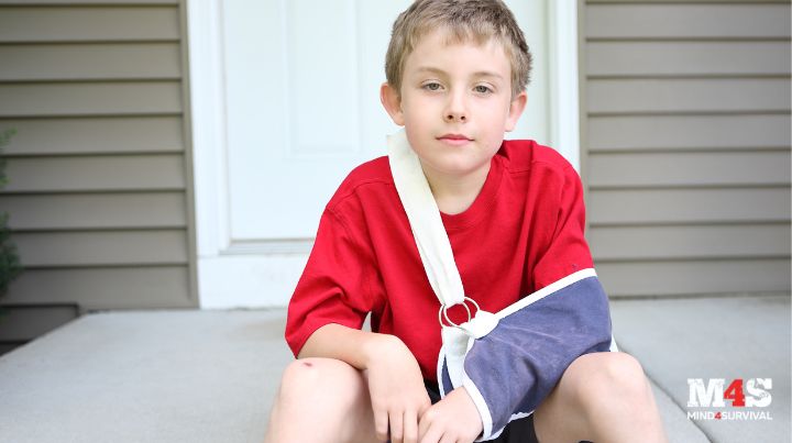Child with a broken arm in a sling