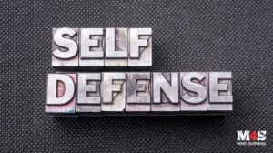 The word "Self-Defense" written in steel.