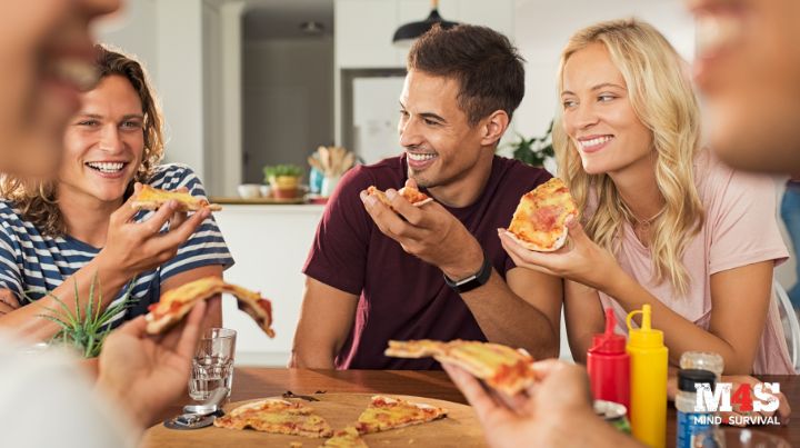 Friends enjoying pizza together.