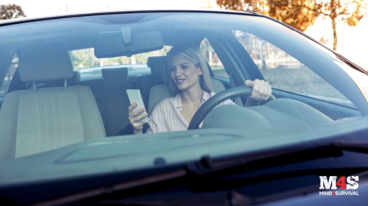 A woman driving while texting