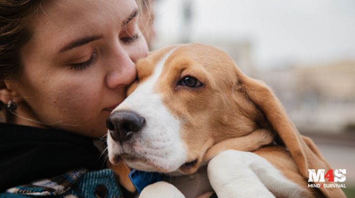 A woman hugging her dog. 