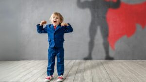 Excited child with shadow of superman