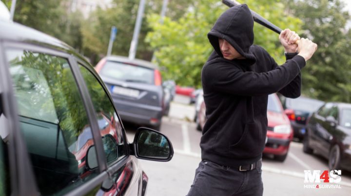 A person breaking into a car