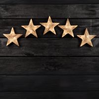 5 Stars on a Wood background